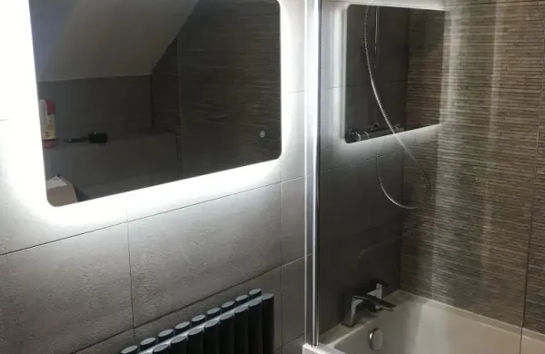 Modern bathroom fittings including illuminated mirror