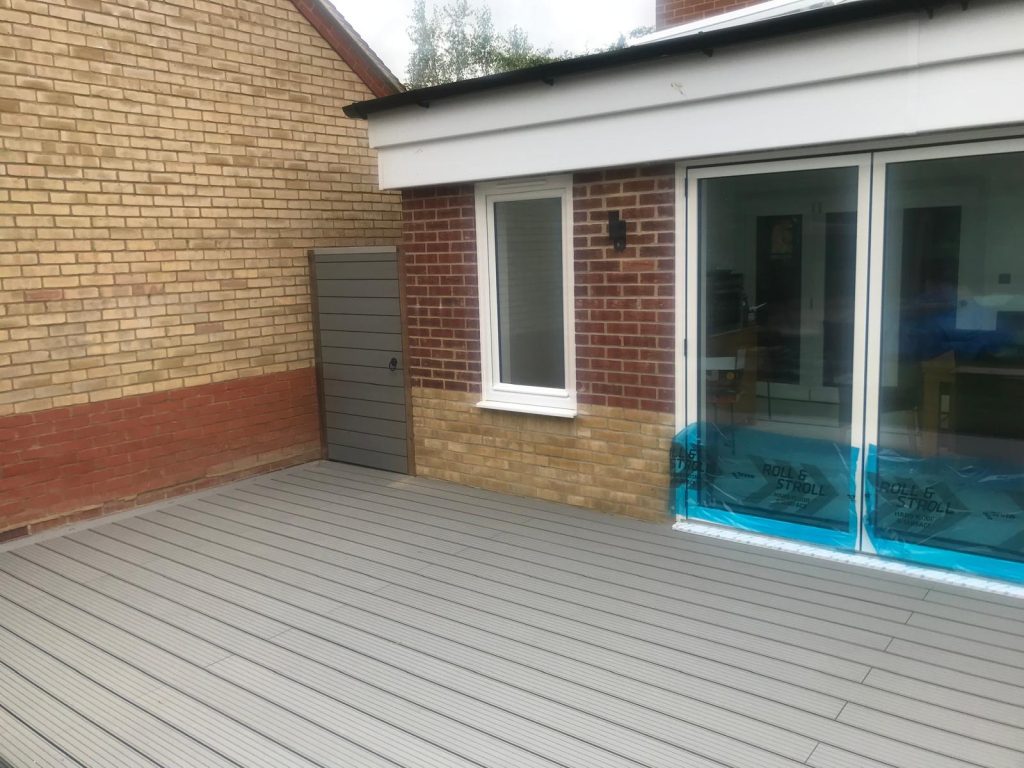 Light grey composite decking with matching gate