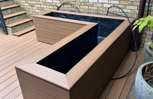 Angled planter with automatic watering system