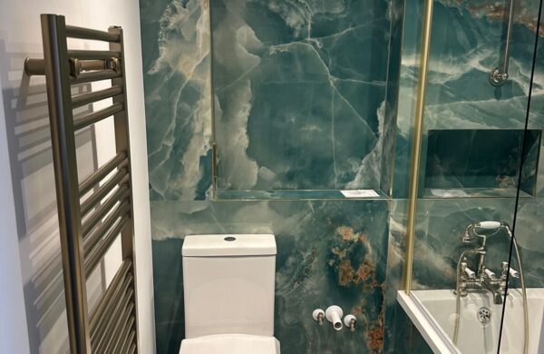 Marbled effect tiling in refurbished bathroom