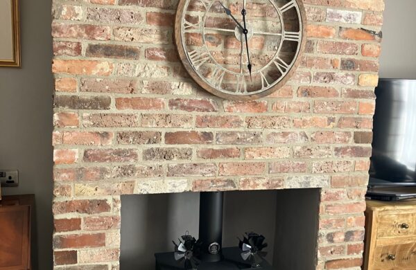 Frontage of brick and slate built garage built in the grounds of at listed building