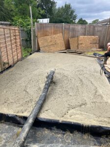Newly pumped concrete into foundation 