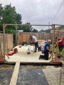 Engineering bricks being laid with templates for doorways 