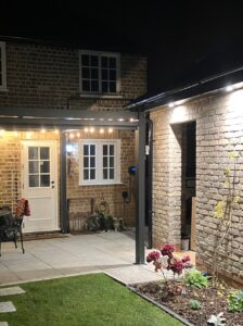 Illuminated overhang, with guttering and drainage in place. 