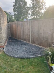 Segment shaped block paving to create storage area (roof added later) 