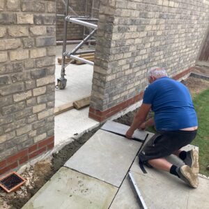 Extending patio to meet side door of garage 
